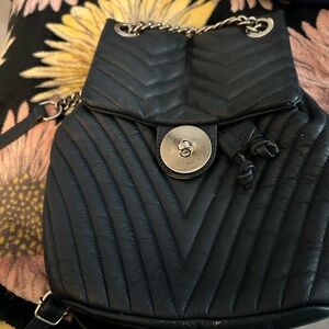 Luxurious Black Quilted Backpack with Gold Hardware